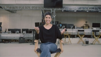 Ashley Burch sat in a chair